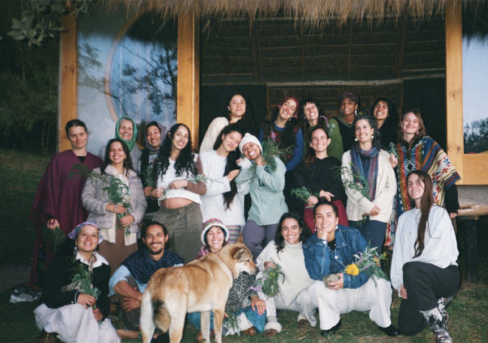 Elemental Birth School cohort gathered with medicinal plants at Finca Ocelote in the Colombian Andes